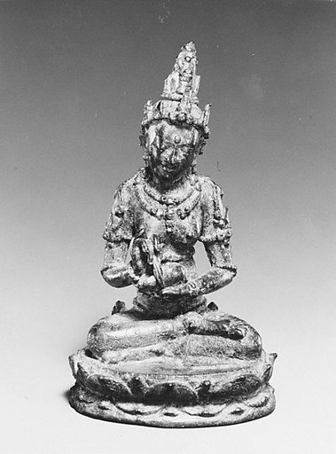 Seated Female Deity Holding a Conch and Branch (?)