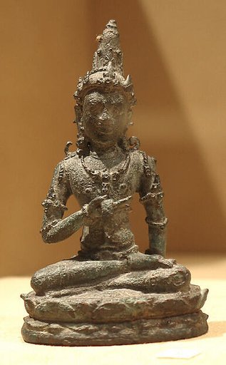 Seated Male Deity Holding a Manuscript(?)