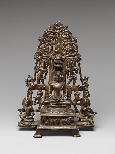 Enthroned Jina Attended by a Yaksha, a Yakshi, and Chauri-Bearers