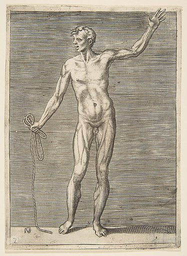 Man seen from the front, holding a rope in his right hand