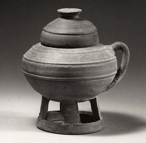 Pedestal jar with handle and lid