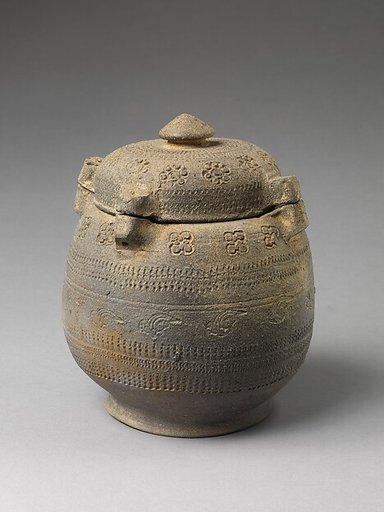 Covered urn with geometric decoration