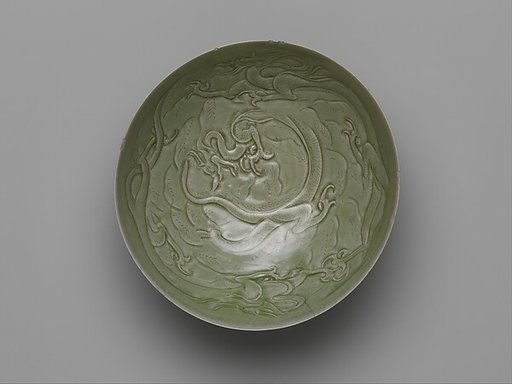 Bowl with dragons amid waves