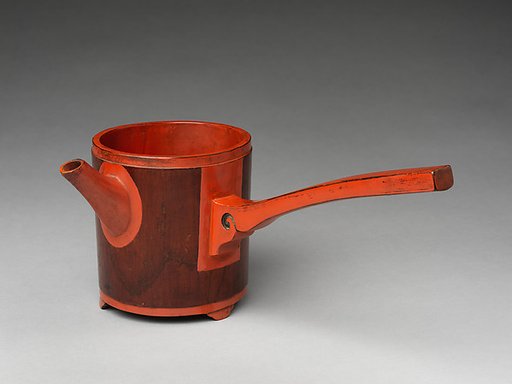 Pouring vessel with handle
