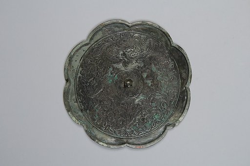 Mirror decorated with palmette and arabesque motifs