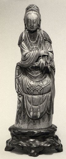 Seated Figure of Guanyin on Rock Base with Carved Armrest