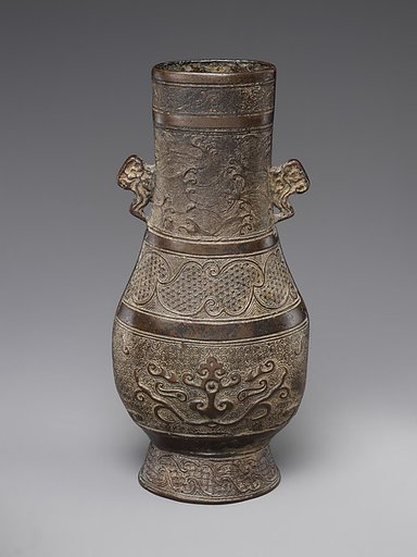 Vase with waves and animal masks