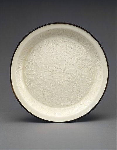 Plate with two deer amid flowers