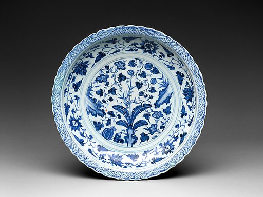 Foliated plate with rocks, plants, and melons