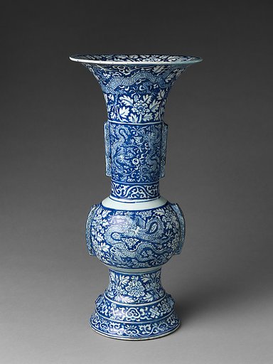 Vase with dragons amid flowers