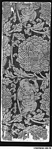 Sutra cover with boys holding the stems of large flowers