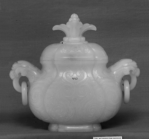 Covered jar with ring handles