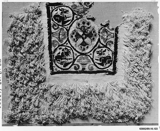 Fragment of a Cover or Blanket with Ornamental Square Featuring Flowers and Animals