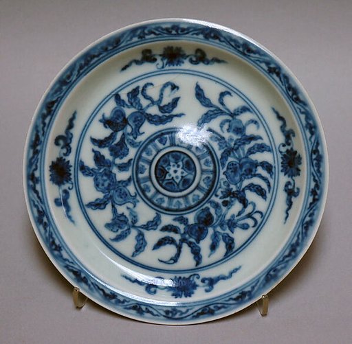 Saucer with pomegranates and peaches