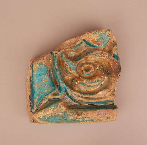 Fragment of a Carved or Molded and Glazed Tile