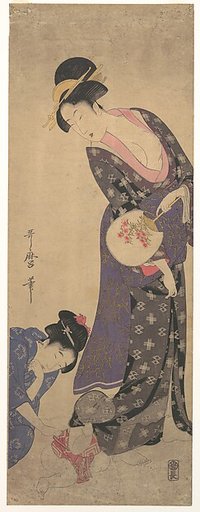 Two Women with a Baby who is Playing on the Floor