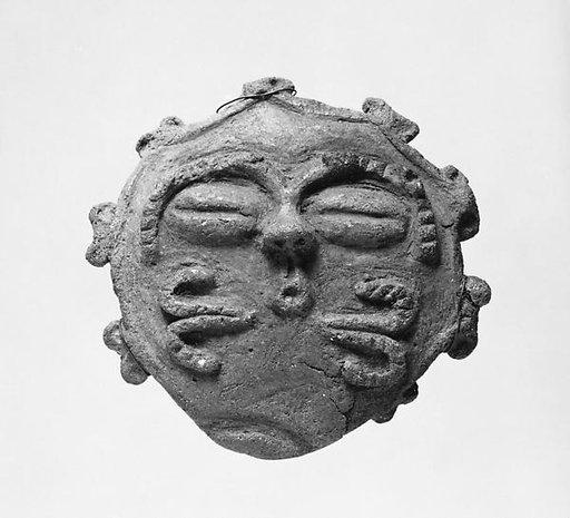 Plaque in the Shape of a Human Face