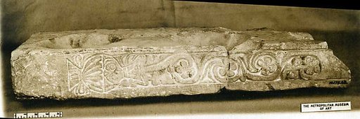Fragment of a Stand for Water Jars Carved with a Vase and Vegetal Scroll