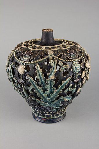 Openwork vase with plants