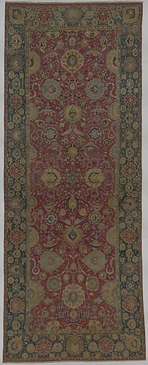 Indo-Persian carpet with vine scroll and palmette pattern