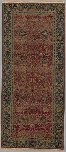Indo-Persian carpet with vine scroll and palmette pattern