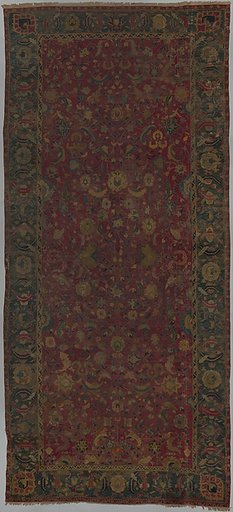 Indo-Persian carpet with vine scroll and palmette pattern