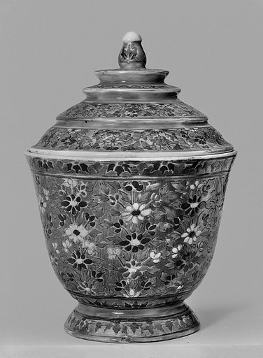 Covered cup with floral pattern