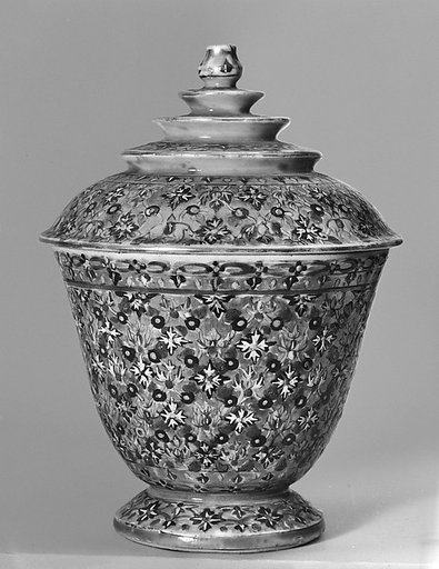 Covered cup with floral pattern