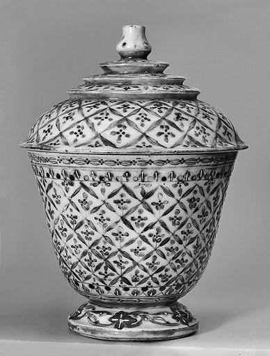 Covered cup with floral pattern