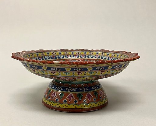 Footed dish with floral pattern