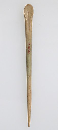 Toilet Implement in the Shape of a Pin