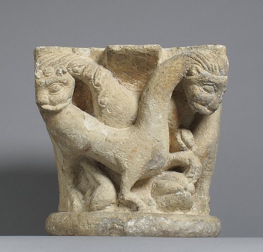 Capital with intertwining animals