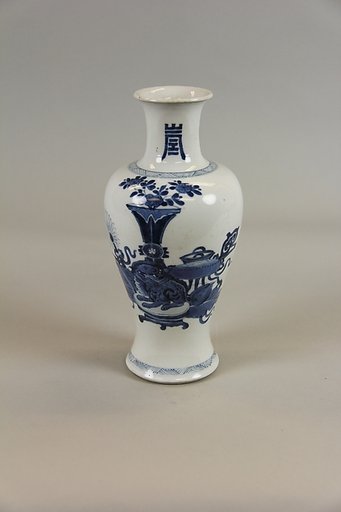 Vase with a display of antiques
