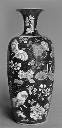 Vase with butterflies and flowers