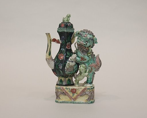 Ewer with a lion-formed handle