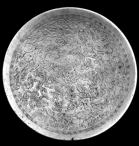 Bowl with boys amid floral sprays