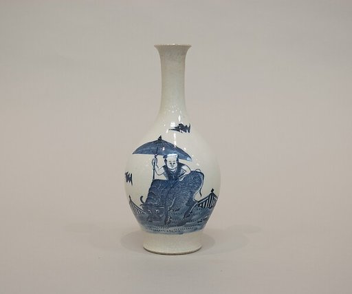 Vase with boy riding an ox