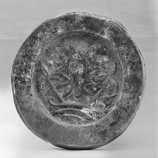 Tile end with lotus flower