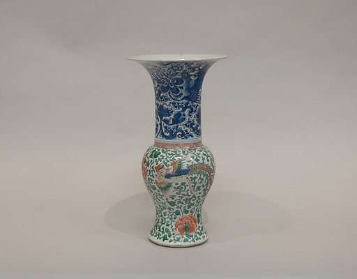 Vase with phoenixes amid flowers