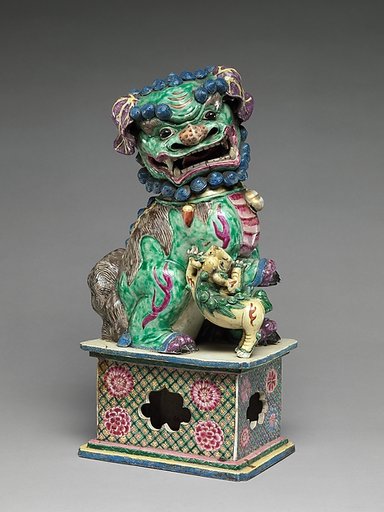 Figure of a lioness and a cub (one of a pair)