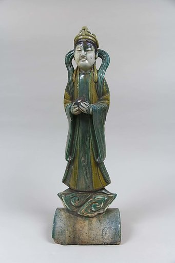 Roof tile with a standing figure