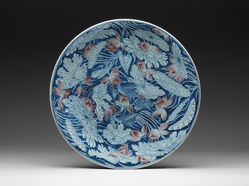 Plate with egrets in a lotus pond