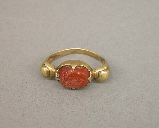 Ring with Oval-Shaped Red Stone