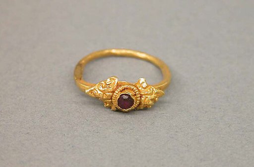 Ring with Purple Stone Surrounded by Foliate Designs