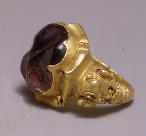 Ring with Large Purple Stone in Oval Mount