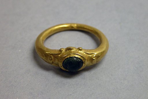 Ring with Green Stone in Circular Setting