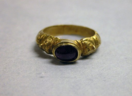 Ring with Red Stone set in Unadorned Bezel