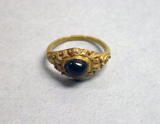 Stirrup-shaped Ring with Purple Stone