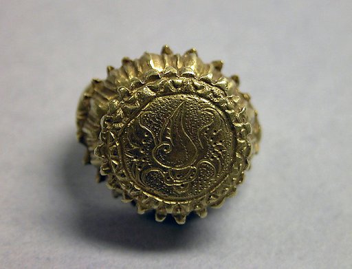 Stirrup-shaped Ring with Circular Bezel with Inscribed "Shankha"