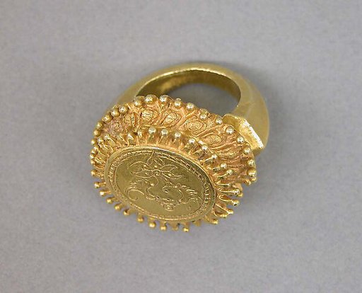 Stirrup-shaped Ring with Circular Bezel with Inscribed "Shankha"